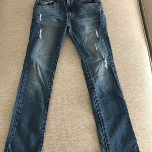 2 pairs of jeans both have embellishments